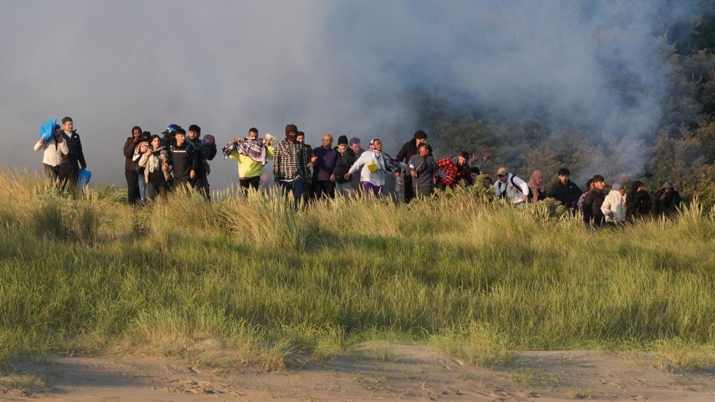 French police fire tear gas at migrants