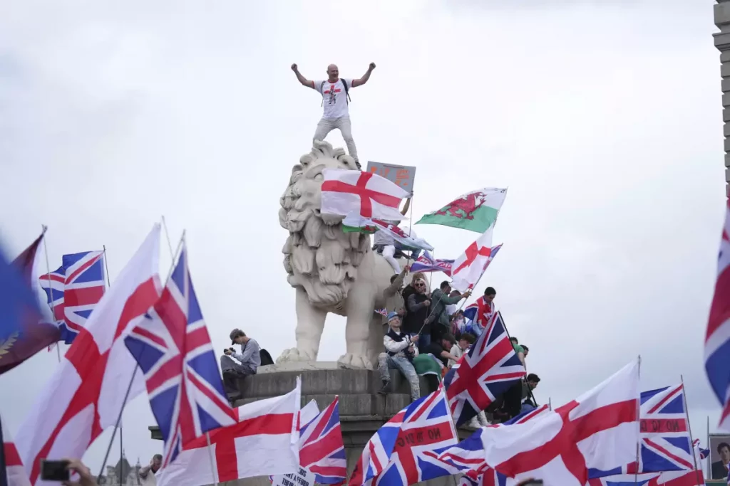 Elon Musk anti migrant rally UK