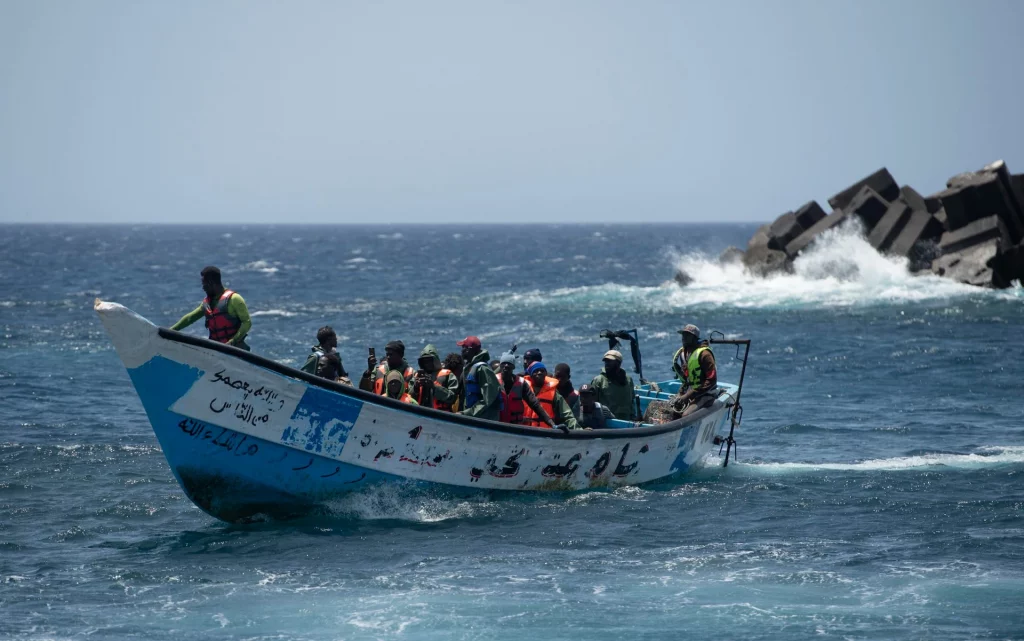 Spain arrests 19 over migrant killings