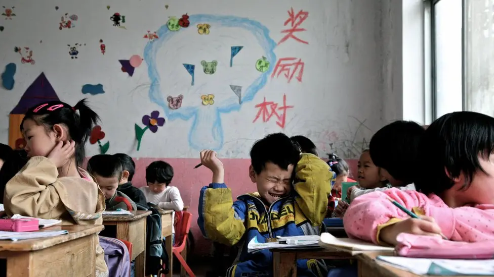 China Expands Efforts to Support Migrant and Left-Behind Children China migrant children support policy